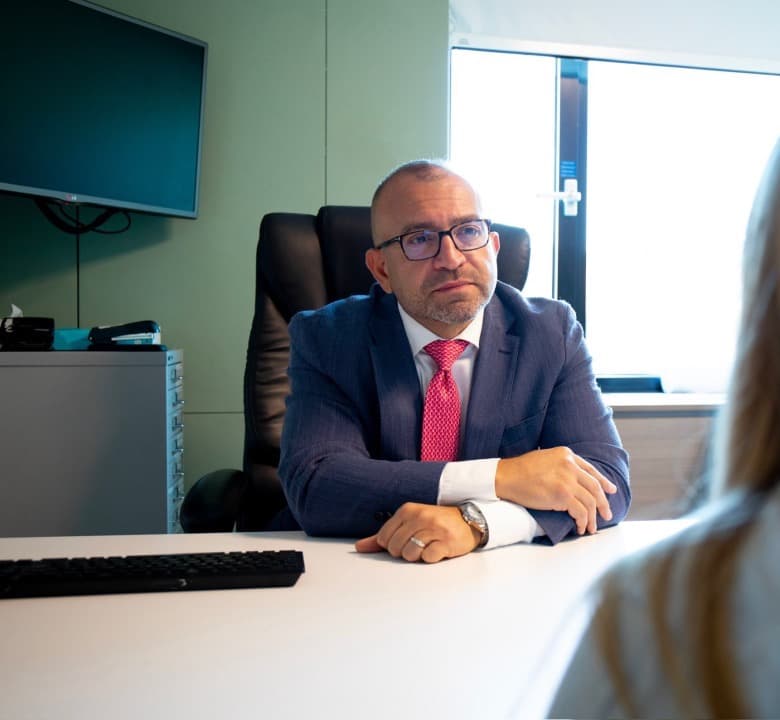 Mr Anwar in consultation with a patient at his clinic